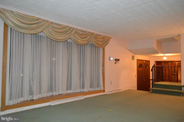 a view of a room with wooden walls