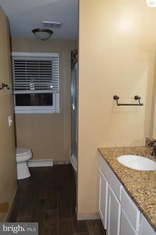 a view of room with window and ceiling fan