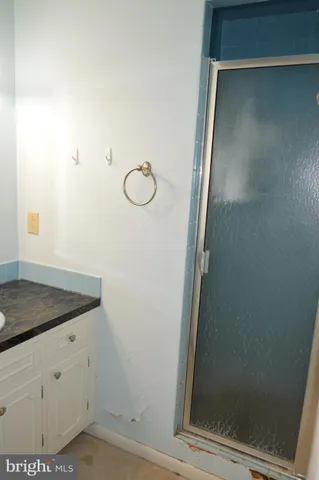 a view of a room with wooden floor and a window