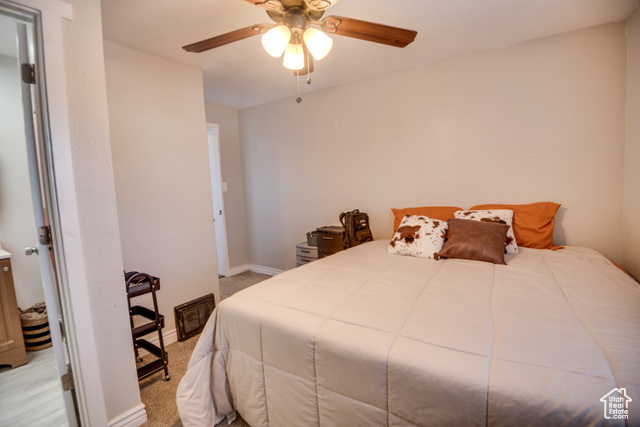 410 North Main Street Beaver, UT 84713 - Photo 9 of 31 Carpeted bedroom with ceiling fan