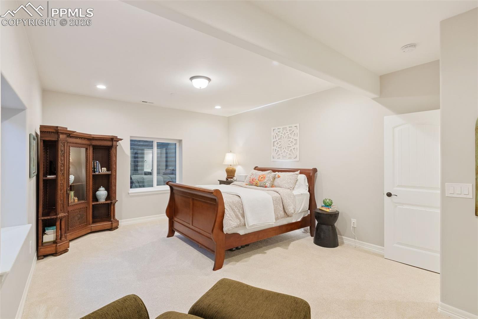 5318 Rocking Tree Grove Colorado Springs, CO 80906 - Photo 32 of 49 Another generously sized suite demonstrates the home's capacity to comfortably host multiple generations under one roof without compromising on individual privacy