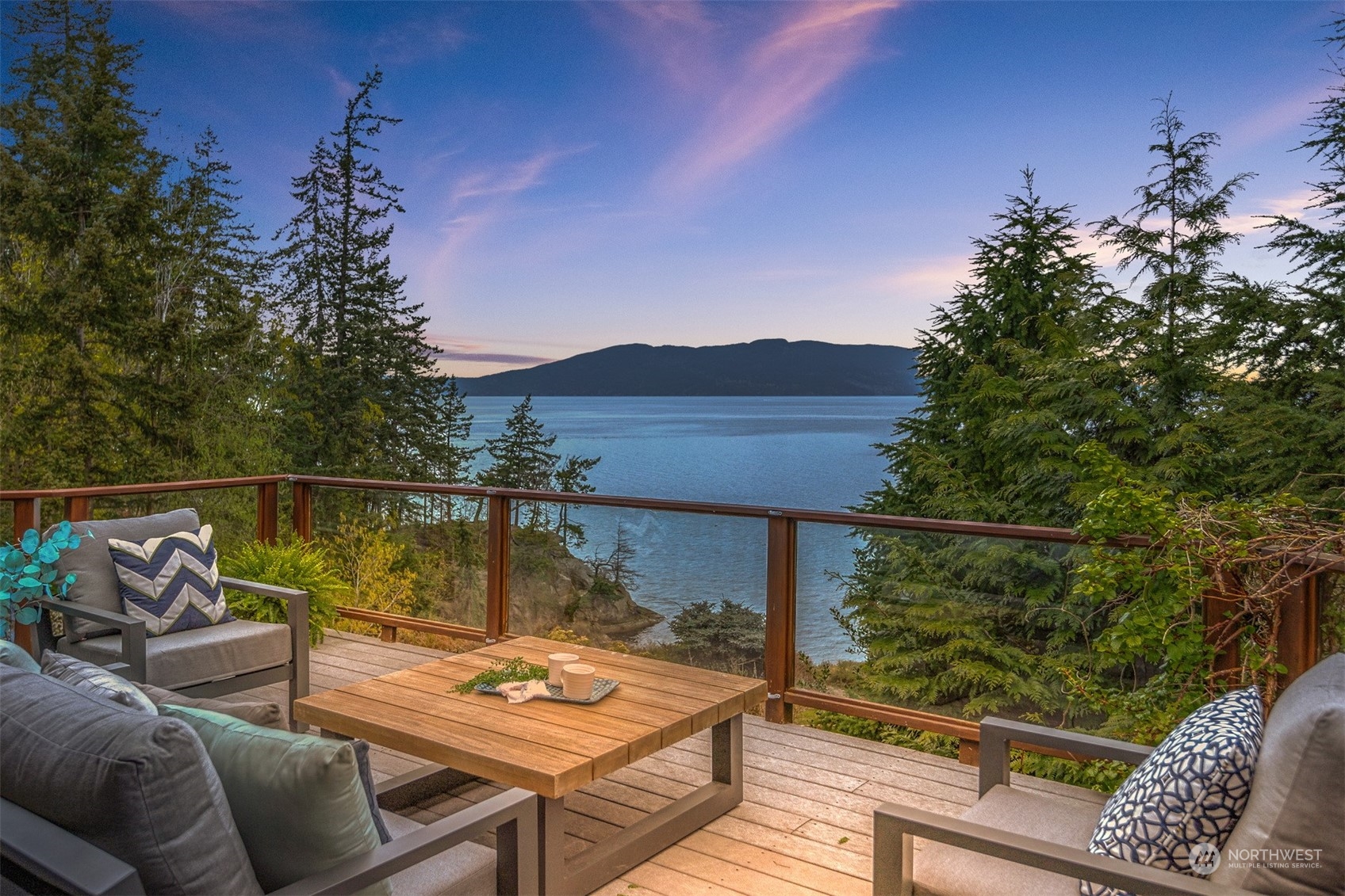 804 Fieldston Road Bellingham, WA 98225 - Photo 12 of 40 a view of a balcony with two chairs and a potted plant