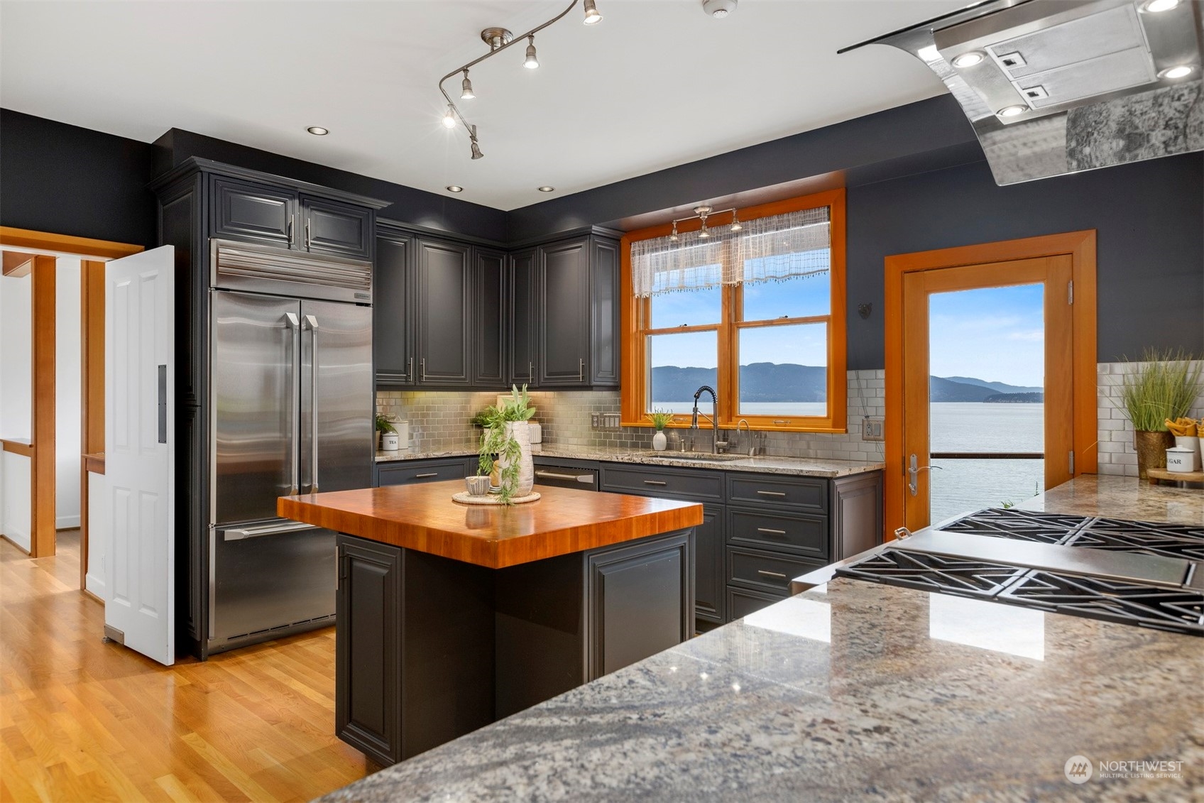 804 Fieldston Road Bellingham, WA 98225 - Photo 13 of 40 a kitchen with stainless steel appliances granite countertop a sink stove and refrigerator
