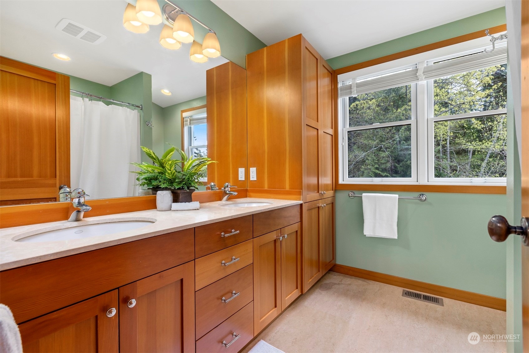 804 Fieldston Road Bellingham, WA 98225 - Photo 27 of 40 a bathroom with a double vanity sink and a mirror