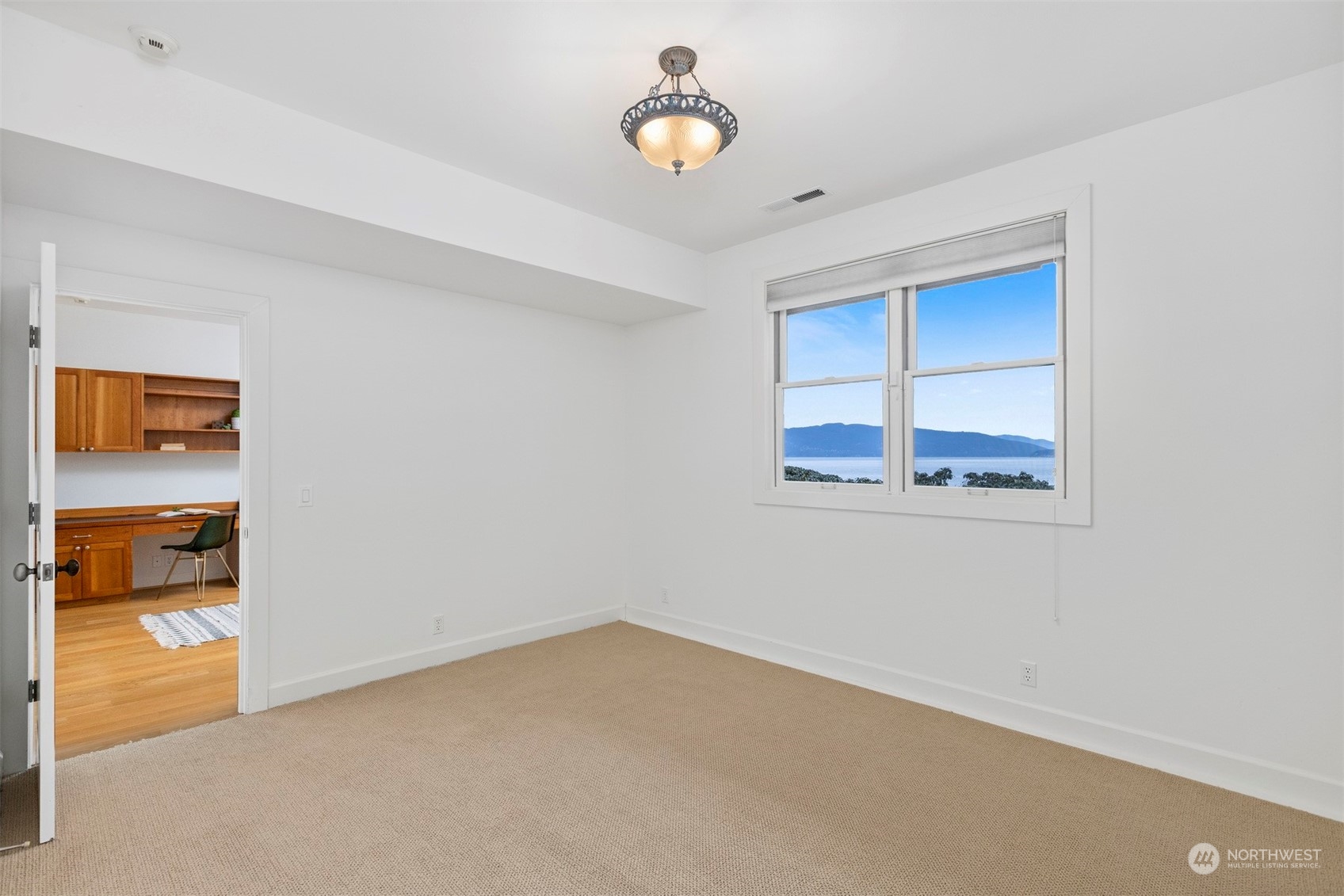 804 Fieldston Road Bellingham, WA 98225 - Photo 30 of 40 a view of an empty room with cabinet and a window
