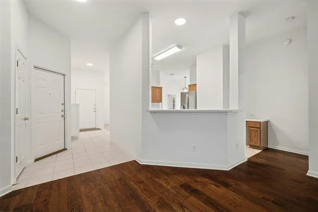 a view of a kitchen cabinets and wooden floor