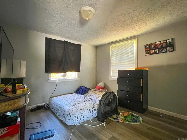 a view of a backyard with a tree