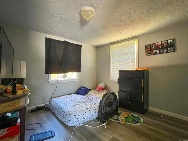 a view of a backyard with a tree