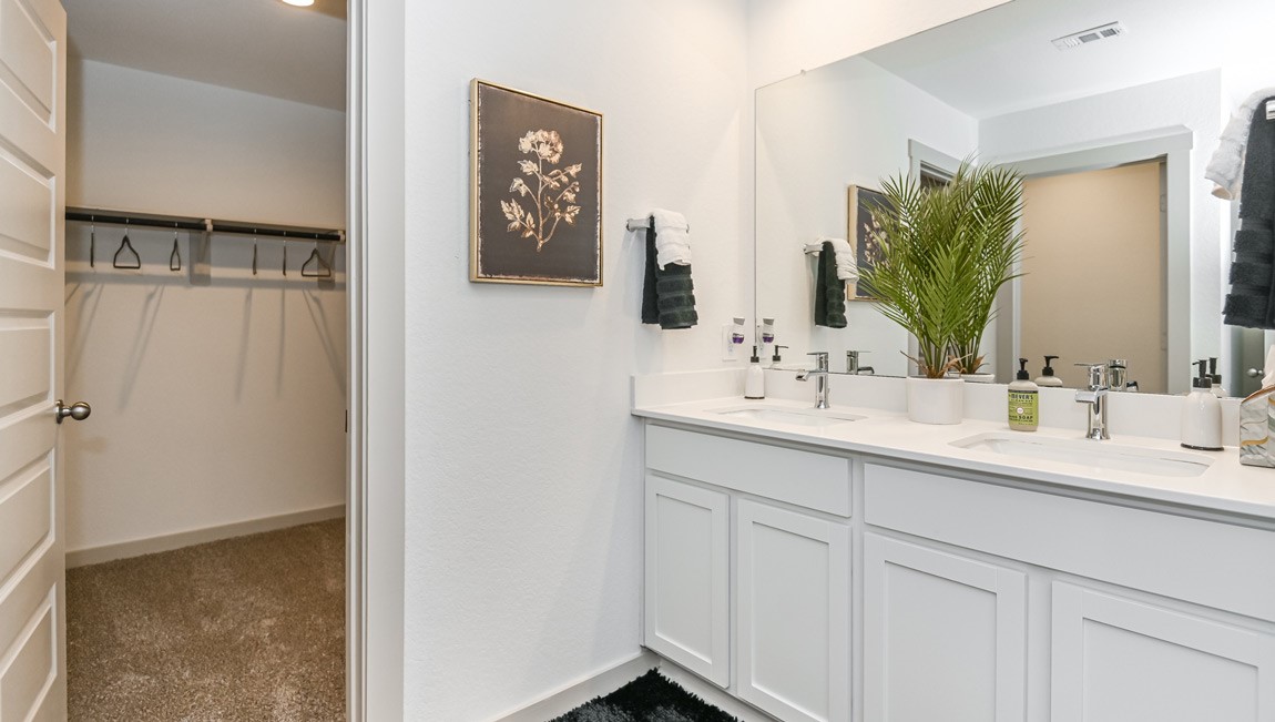 7918 Murciana Drive Rosharon, TX 77583 - Photo 16 of 21 a bathroom with a double vanity sink and a mirror