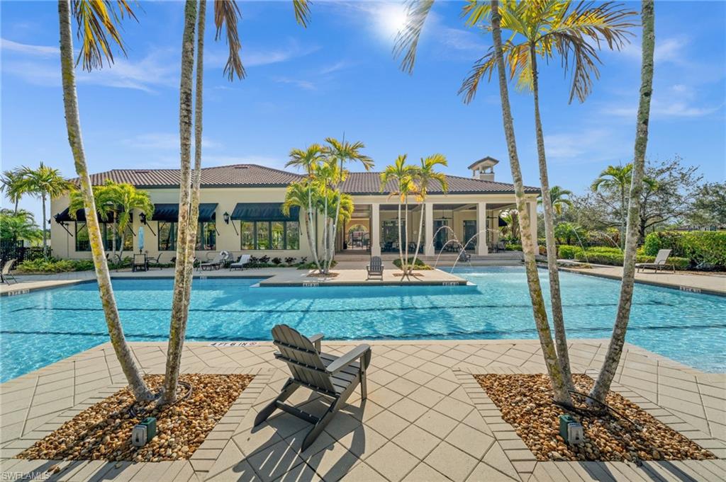 4754 Abaca Circle Naples, FL 34119 - Photo 41 of 46 a view of a house with backyard porch and sitting area