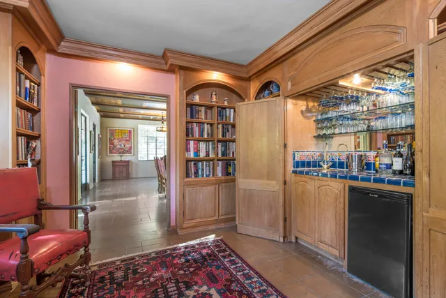 a area with furniture and a book shelf