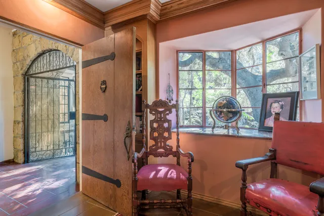 a view of a room with furniture and windows