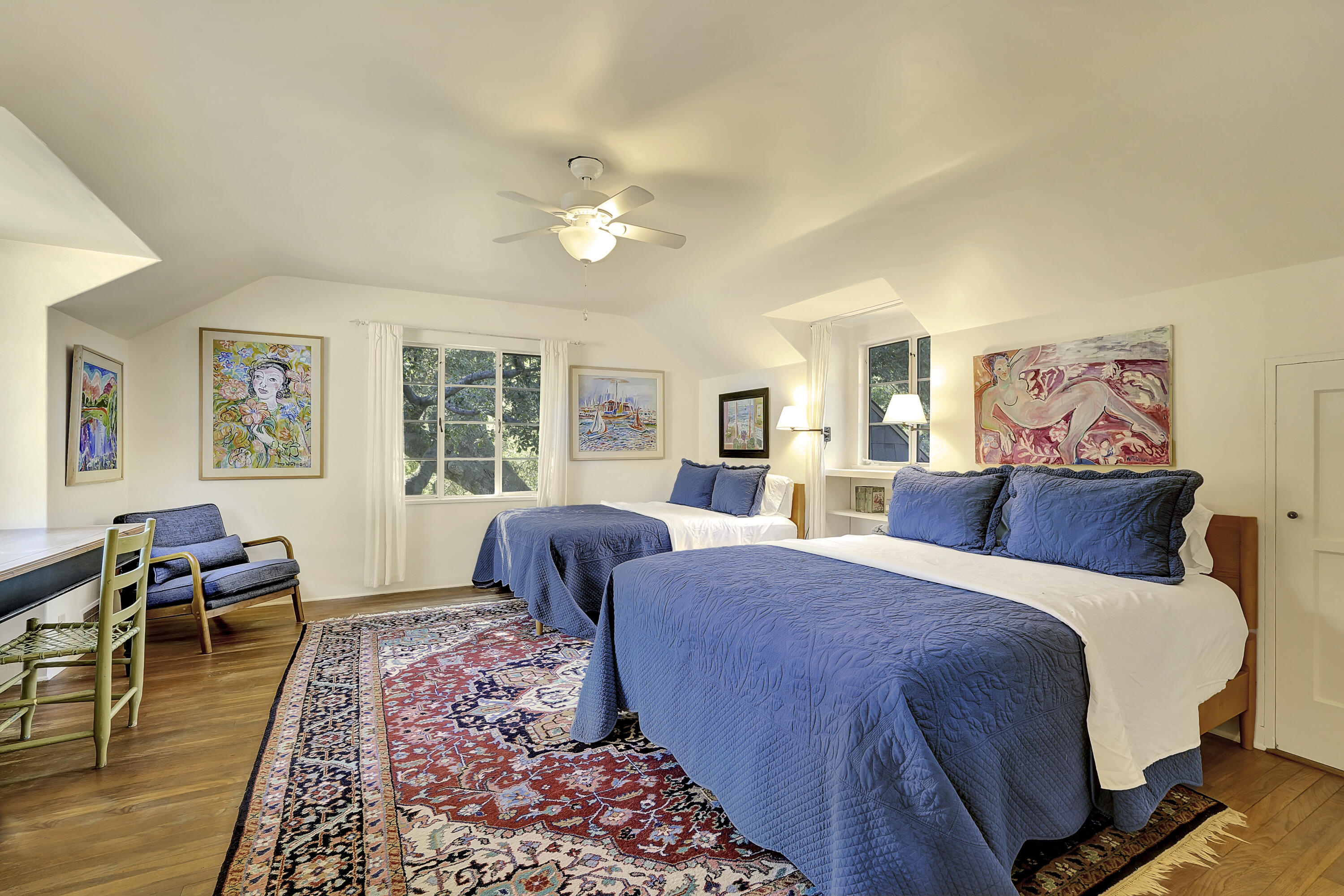 12615 Koenigstein Road Santa Paula, CA 93060 - Photo 25 of 40 a bedroom with a large bed a rug and two windows