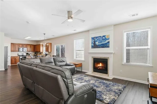 a living room with furniture or fireplace and wooden floor