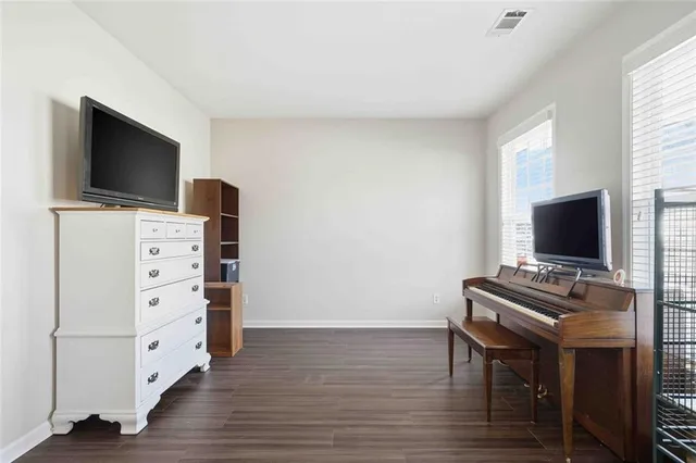 a view of a livingroom with furniture and a flat screen tv