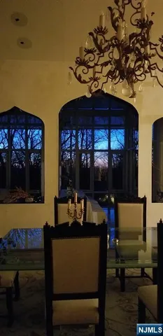 a living room with a couch and a potted plant