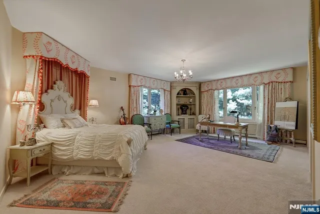 a living room with furniture and a dining room