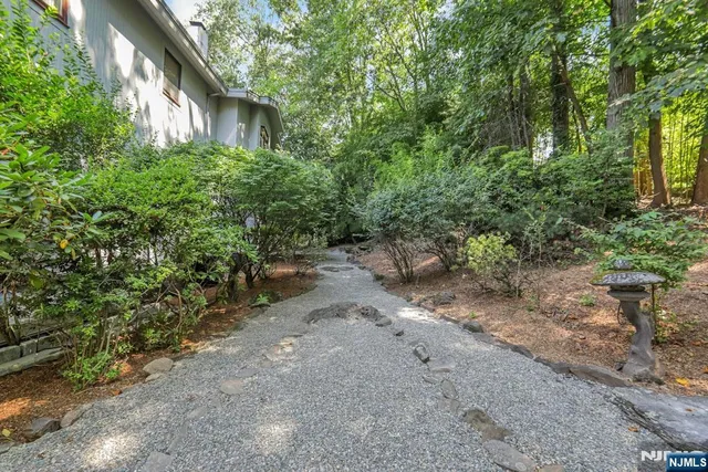 a backyard of a house with lots of green space