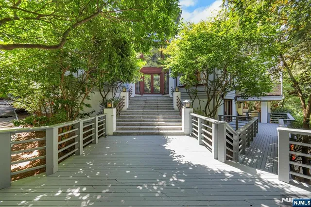 a view of a house with a small yard