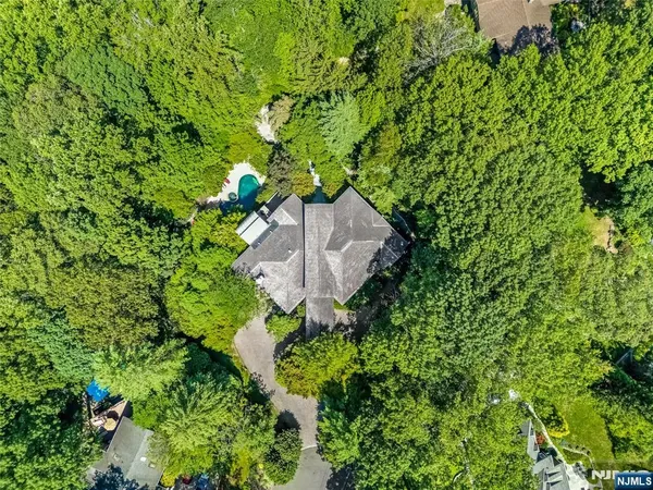 a backyard of a house with lots of green space and garden