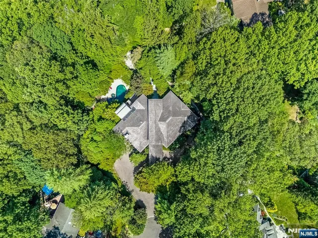 a backyard of a house with lots of green space and garden