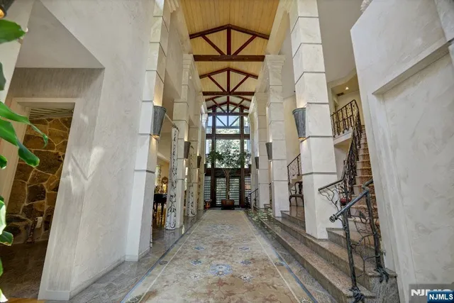 a view of an entryway with wooden floor