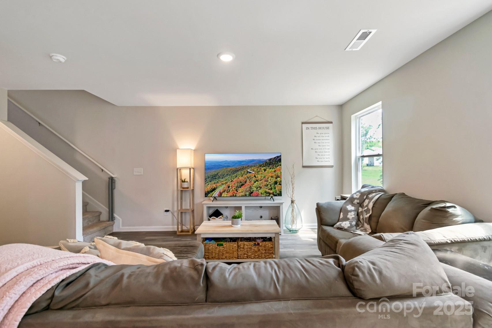 3305 Rian Drive Lenoir, NC 28645 - Photo 14 of 40 a bedroom with a bed and glass window