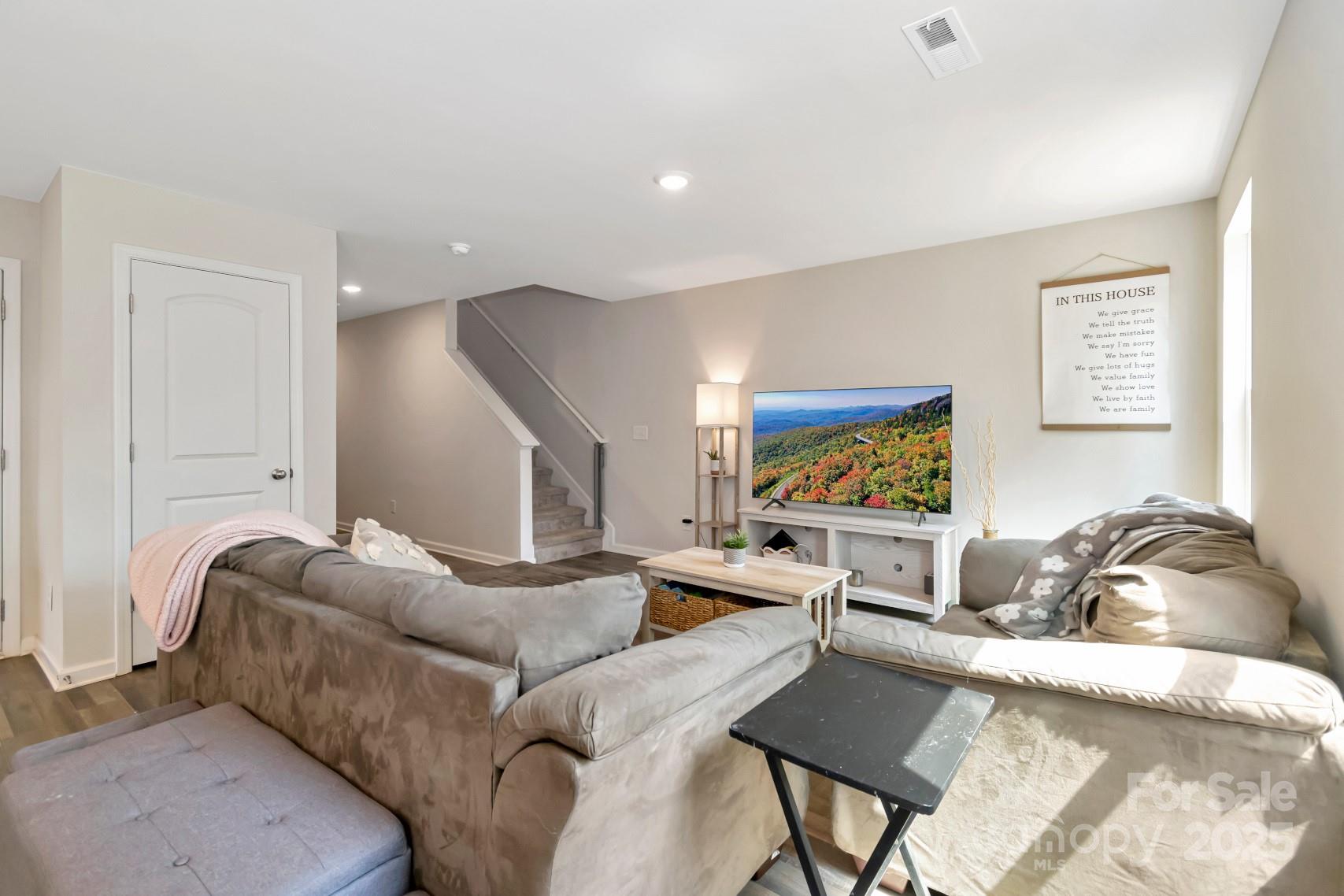3305 Rian Drive Lenoir, NC 28645 - Photo 15 of 40 a living room with furniture and a flat screen tv