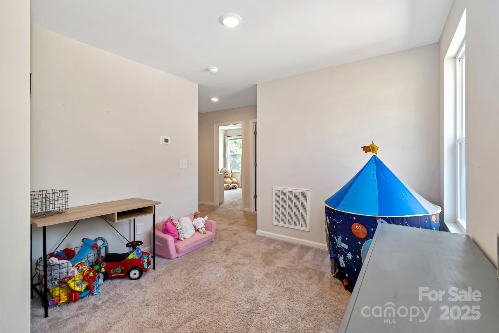 3305 Rian Drive Lenoir, NC 28645 - Photo 17 of 40 a bedroom with a bed and a painting on the wall