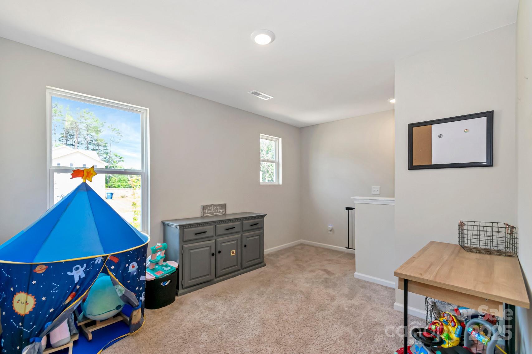 3305 Rian Drive Lenoir, NC 28645 - Photo 19 of 40 a room with furniture and a baby crib