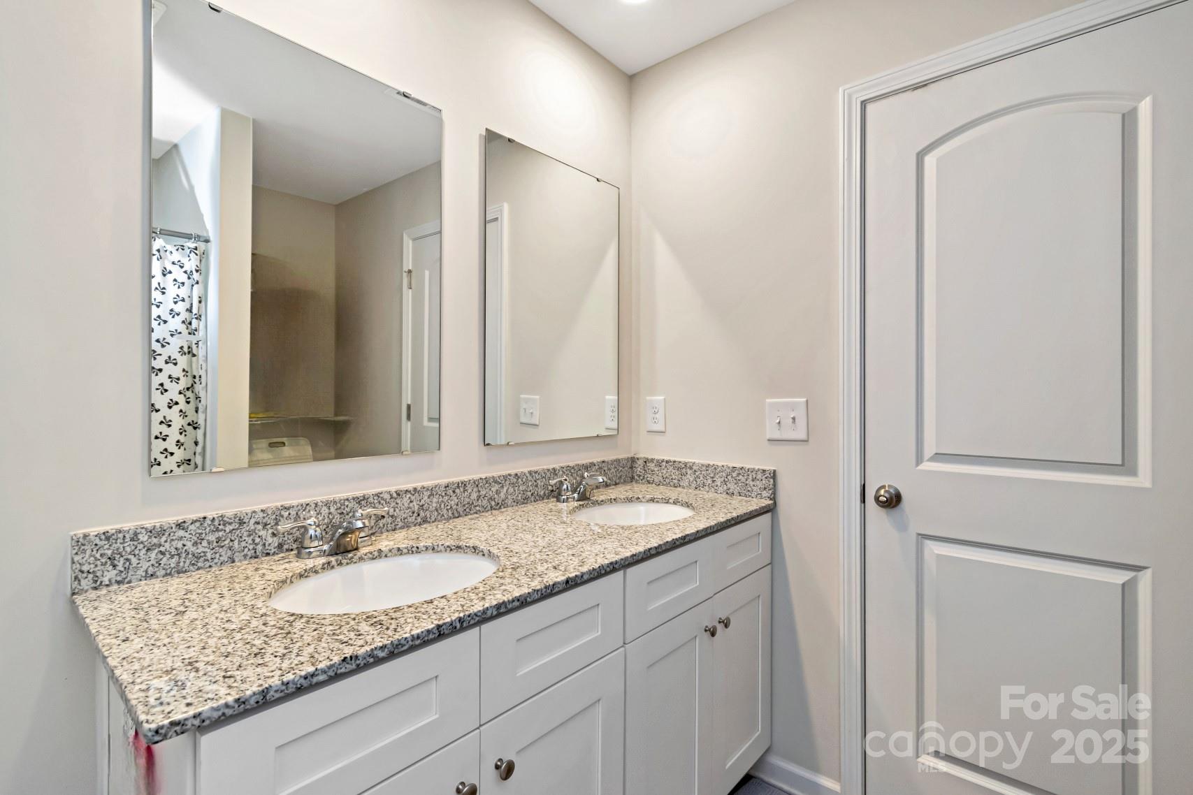 3305 Rian Drive Lenoir, NC 28645 - Photo 31 of 40 a bathroom with a granite countertop sink and a mirror
