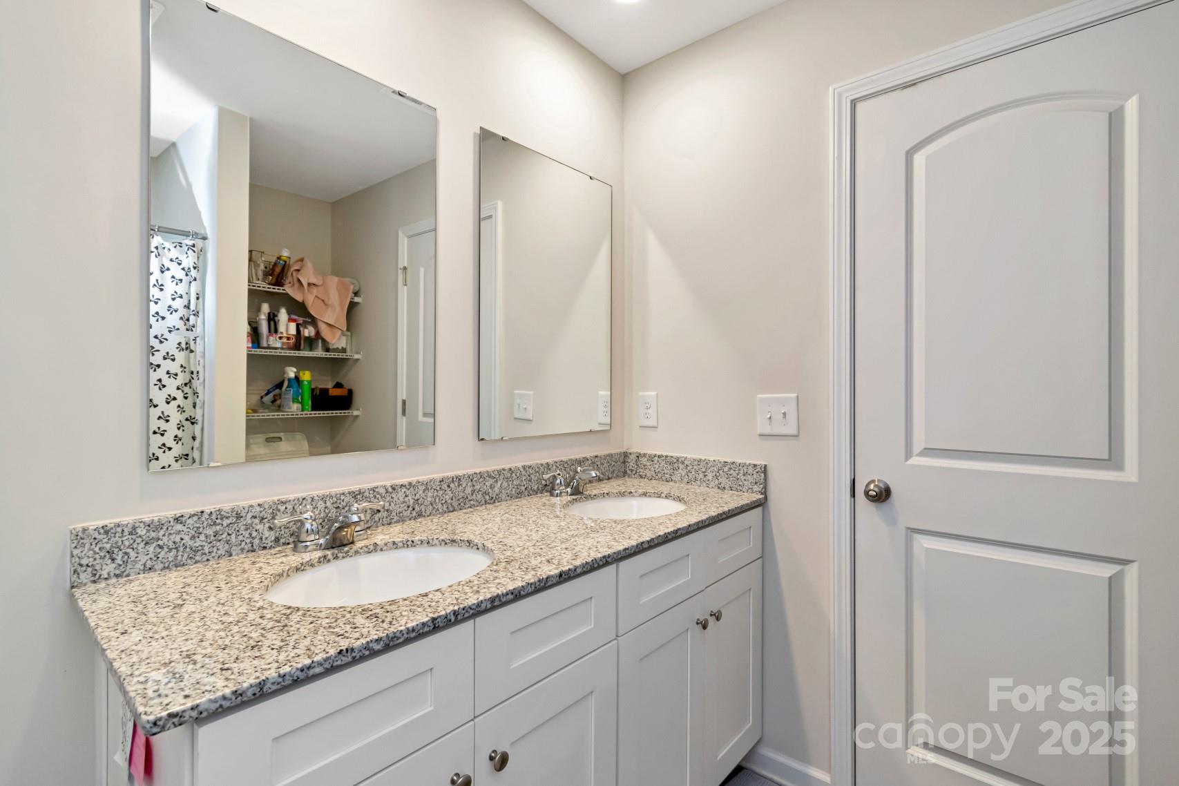 3305 Rian Drive Lenoir, NC 28645 - Photo 32 of 40 a bathroom with a granite countertop sink and a mirror