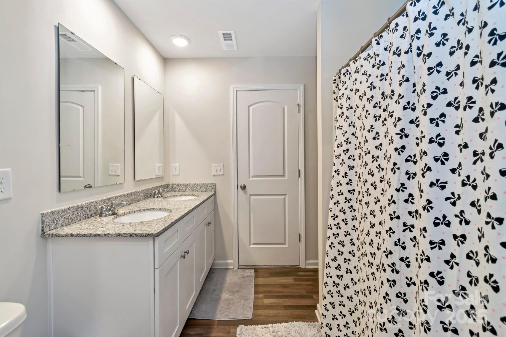3305 Rian Drive Lenoir, NC 28645 - Photo 35 of 40 a bathroom with a granite countertop sink and a mirror
