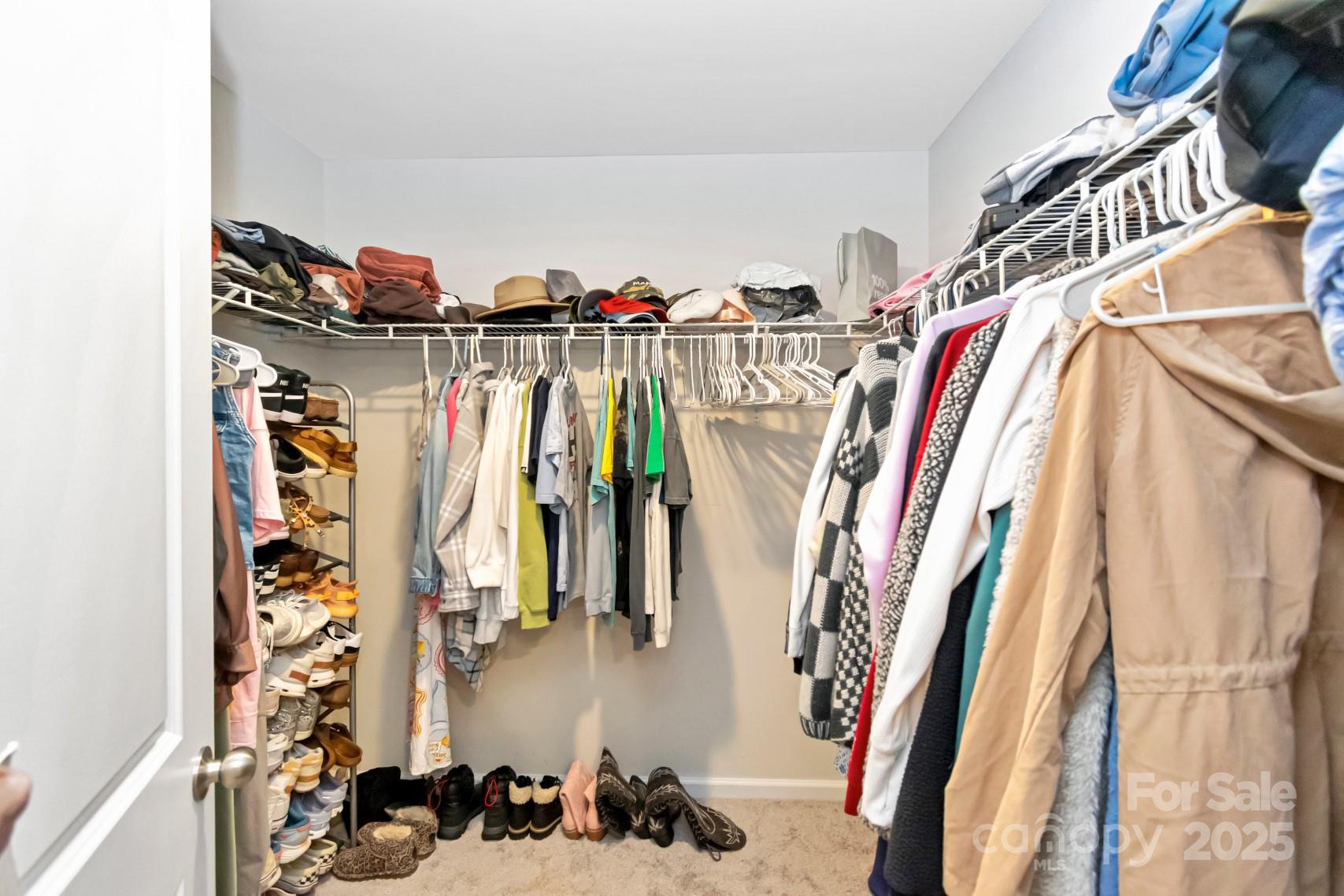 3305 Rian Drive Lenoir, NC 28645 - Photo 36 of 40 a view of walk in closet with clothes and shoes