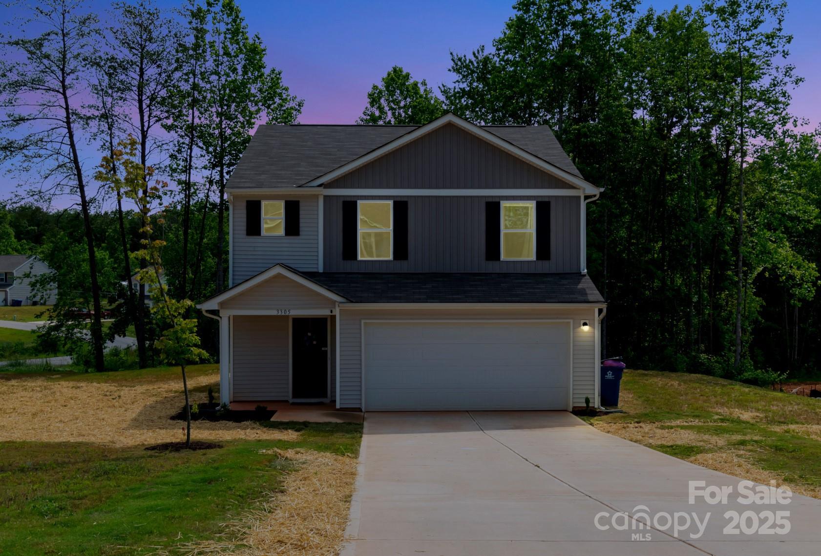 3305 Rian Drive Lenoir, NC 28645 - Photo 38 of 40 a front view of a house with a garden