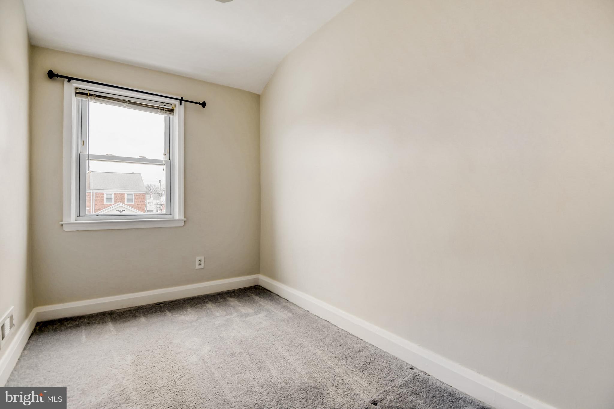 946 Middlesex Road Essex, MD 21221 - Photo 12 of 22 an empty room with a window