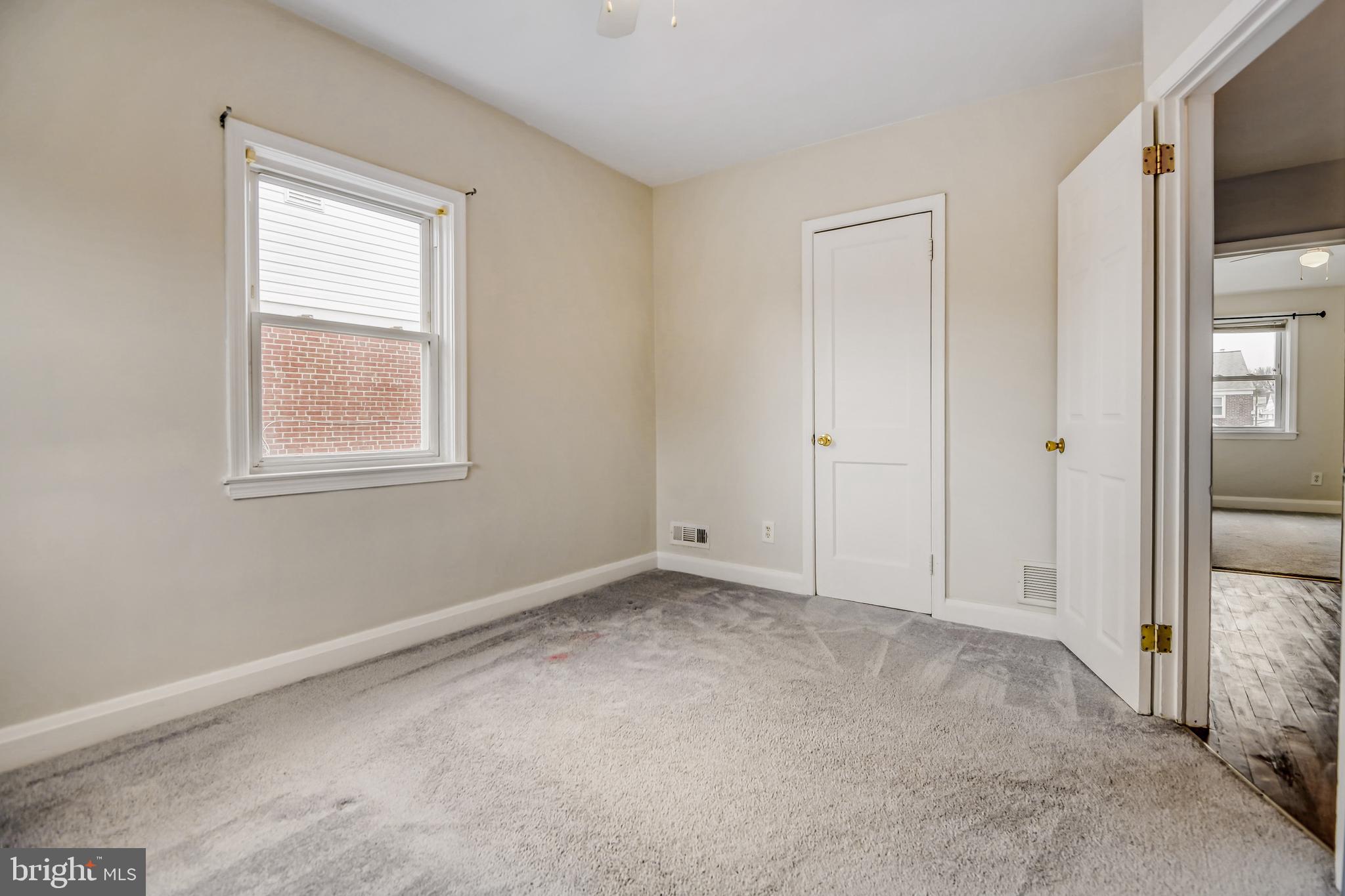 946 Middlesex Road Essex, MD 21221 - Photo 13 of 22 an empty room with windows and closet