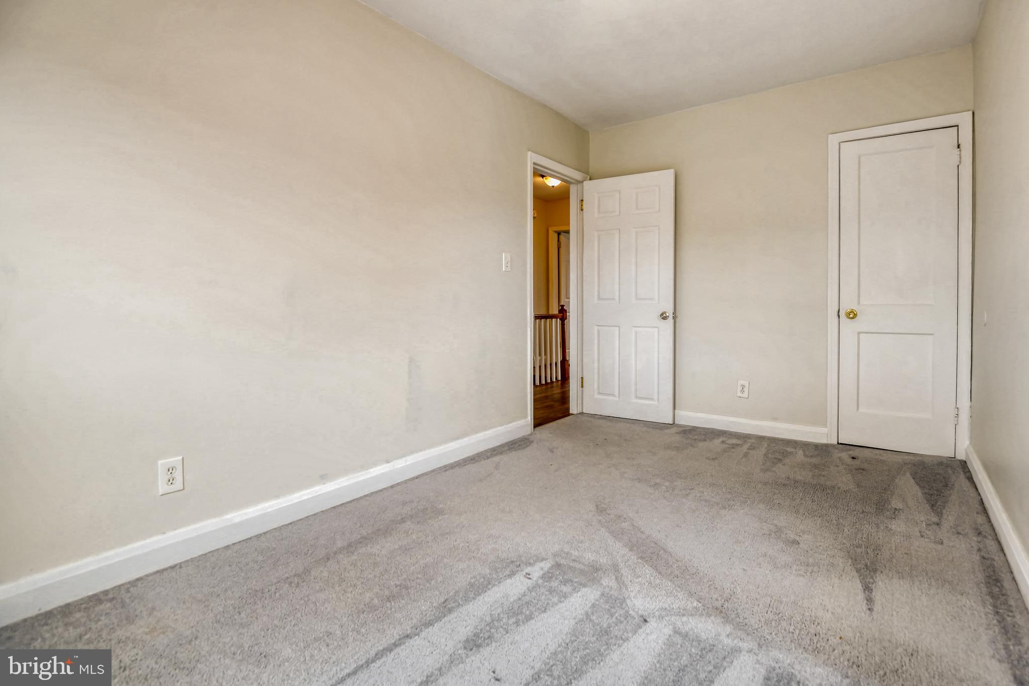 946 Middlesex Road Essex, MD 21221 - Photo 15 of 22 a view of an empty room and closet area
