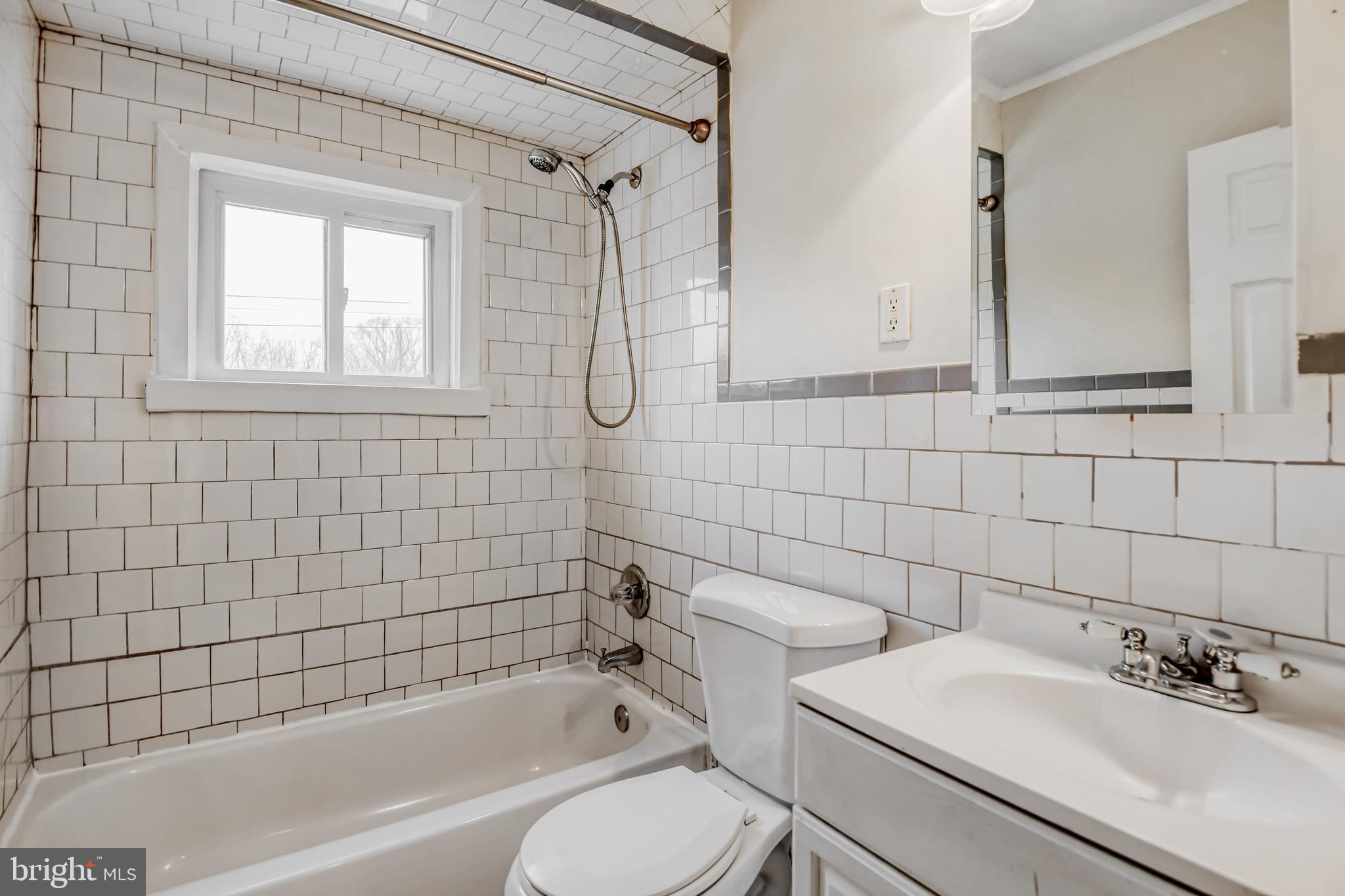 946 Middlesex Road Essex, MD 21221 - Photo 16 of 22 a bathroom with a sink toilet and shower