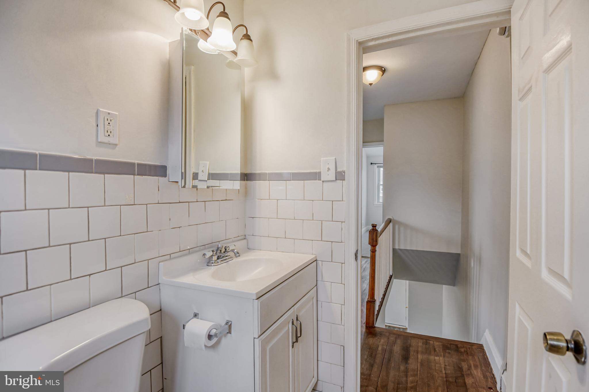 946 Middlesex Road Essex, MD 21221 - Photo 17 of 22 a bathroom with a sink a toilet and shower