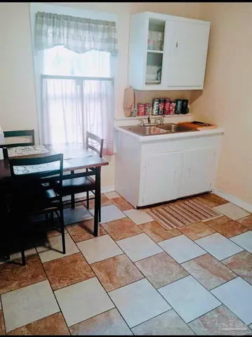 a room with a table and a window