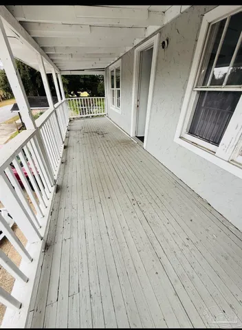 a view of deck with wooden floor and staircase