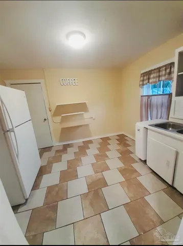 a room with a black white checkered floor