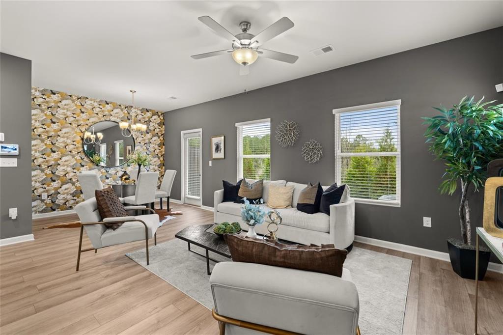 277 Epping Street, Unit 79 Stockbridge, GA 30281 - Photo 26 of 49 a living room with furniture and a large window