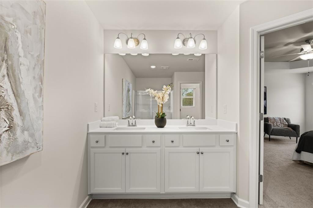 277 Epping Street, Unit 79 Stockbridge, GA 30281 - Photo 44 of 49 a bathroom with a sink and a mirror