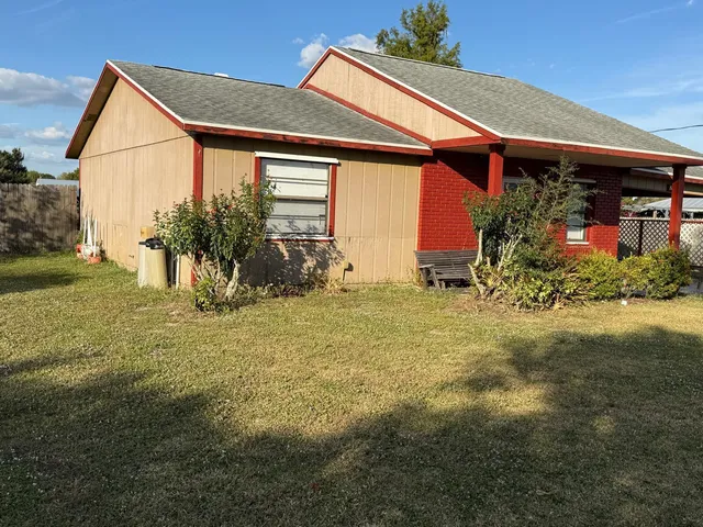 a front view of house with garden