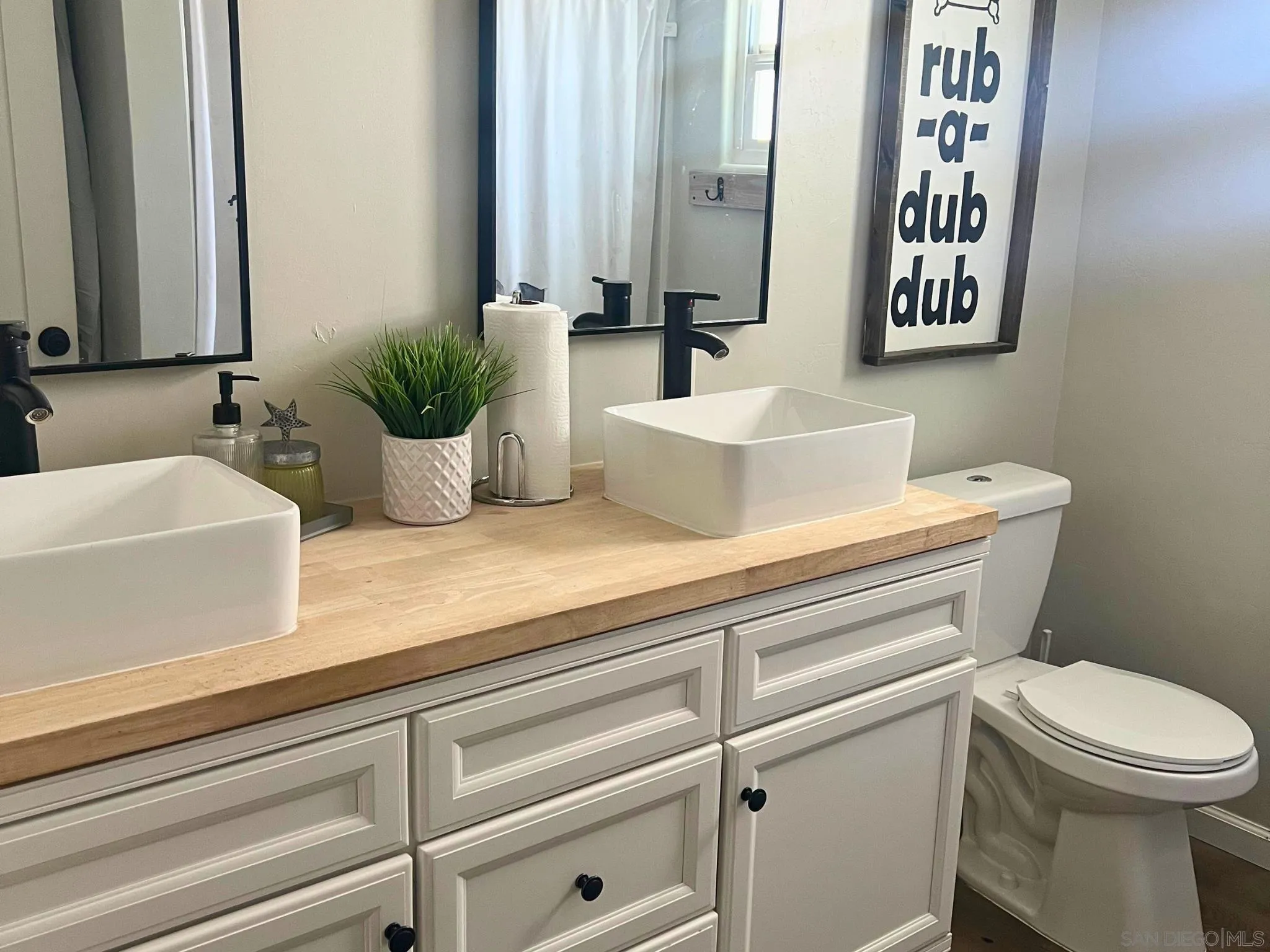 80 Willowside Terrace Alpine, CA 91901 - Photo 17 of 41 a bathroom with a toilet a sink and mirror