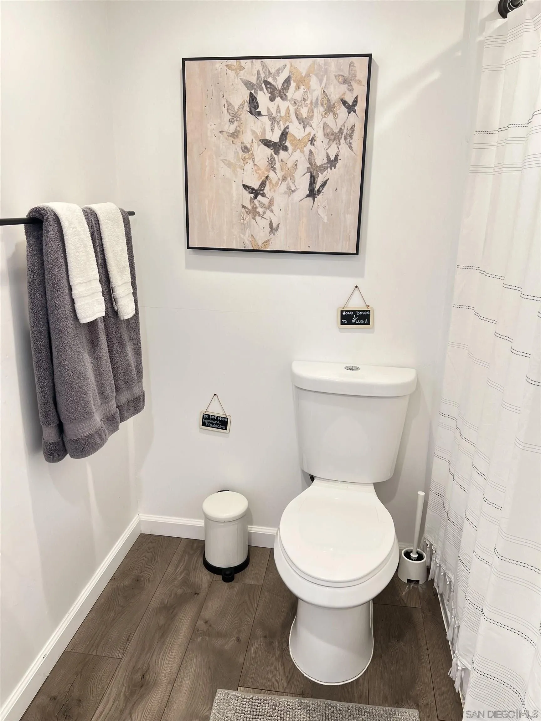 80 Willowside Terrace Alpine, CA 91901 - Photo 37 of 41 a white toilet sitting next to a white sink and vanity