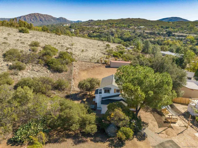 a view of a town with mountains in the background