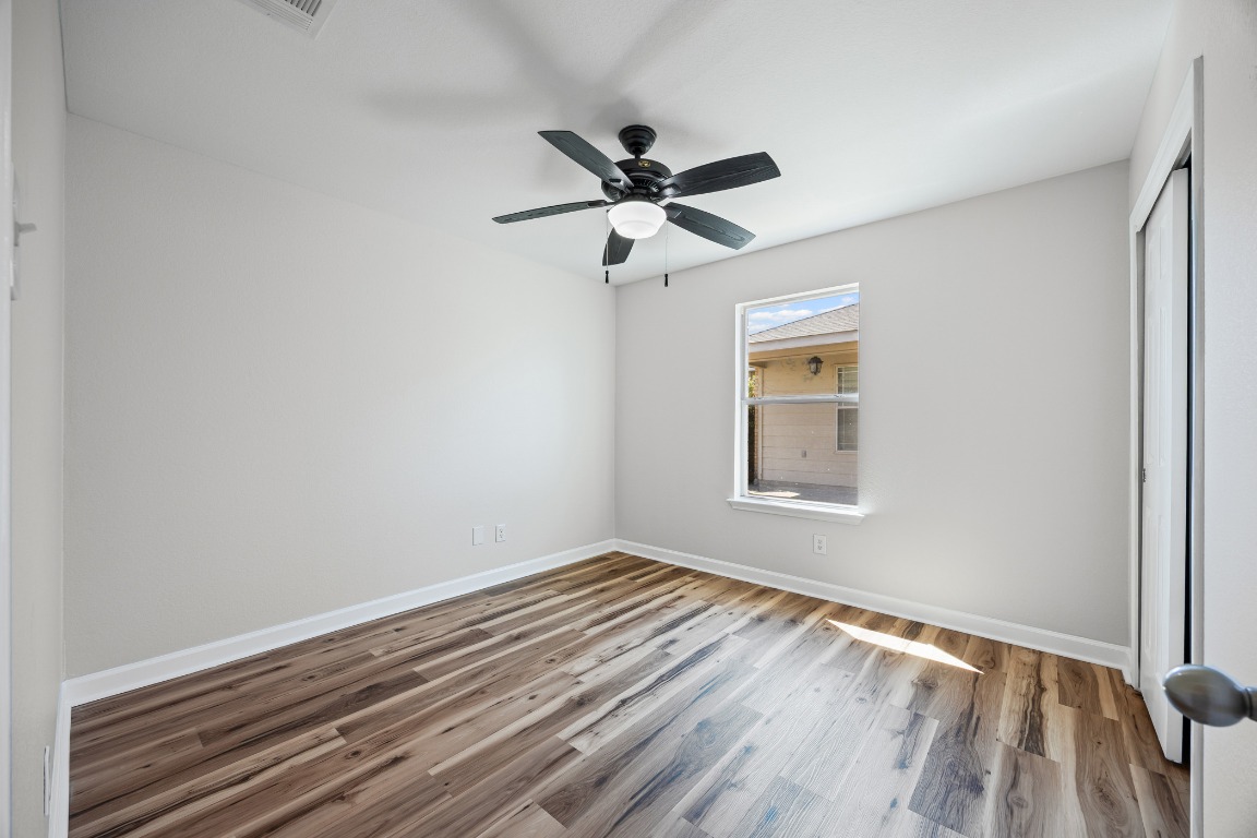 129 Lynn Crest Bend Buda, TX 78610 - Photo 14 of 16 a view of room with window and ceiling fan